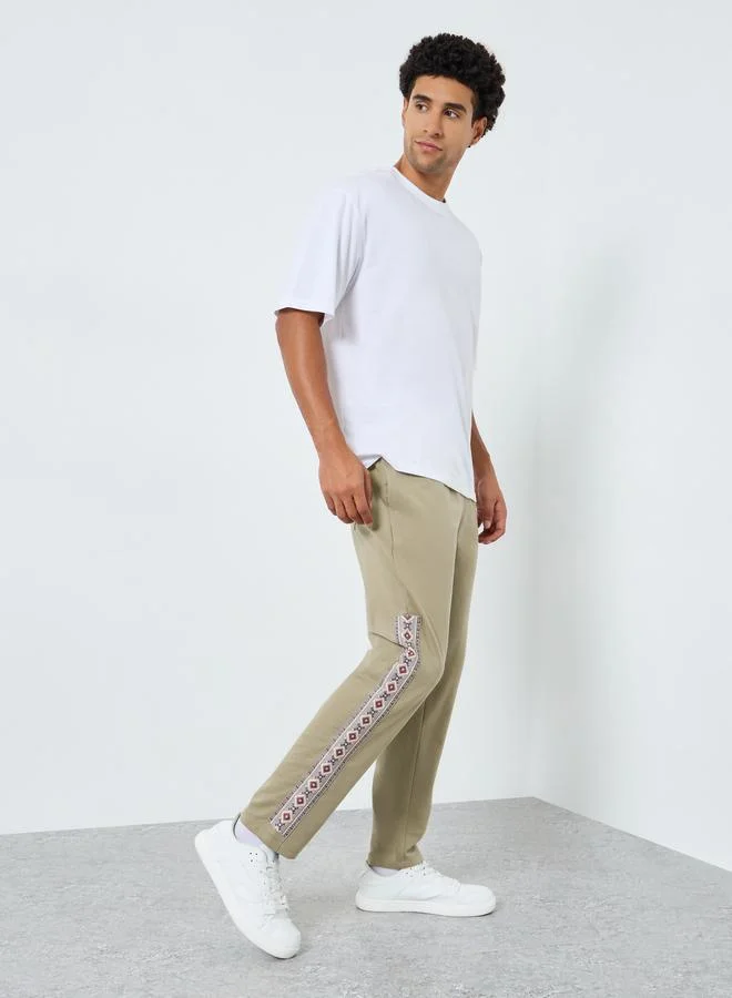 Styli Men Slim Fit Graphic Panel Joggers
